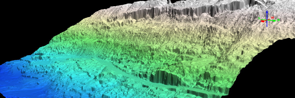 Blue, green and grey point cloud of a steep slope to highlight a landslide location and assess severity and impact.